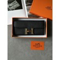 Гаманець Hermès Constance Long To Go: чорна шкіра та золого кольору H