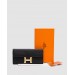 Гаманець Hermès Constance Long To Go: чорна шкіра та золого кольору H