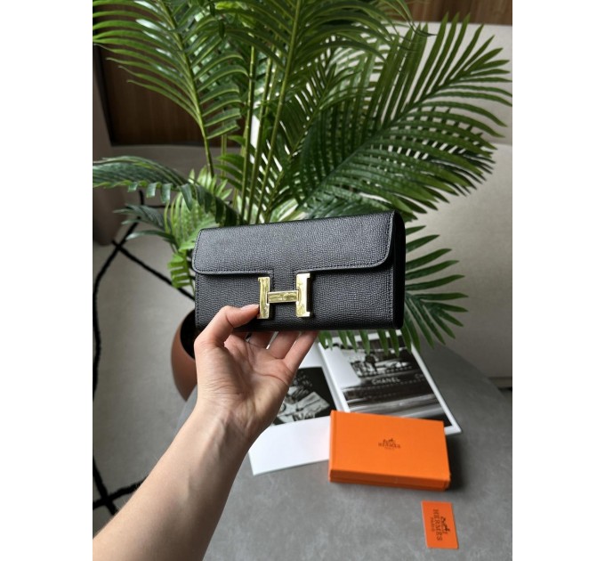 Гаманець Hermès Constance Long To Go: чорна шкіра та золого кольору H