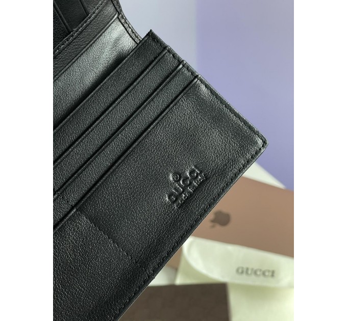 Клатч Gucci Marmont G: гладка шкіра та 12 відділень для карток