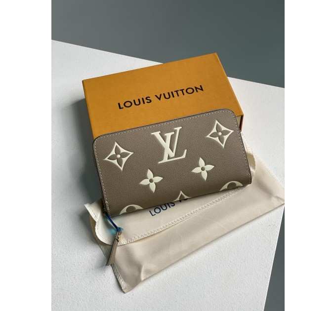 Клатч Louis Vuitton Clemence: двоколірний бежевий із фірмовим тисненням