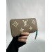 Клатч Louis Vuitton Clemence: двоколірний бежевий із фірмовим тисненням