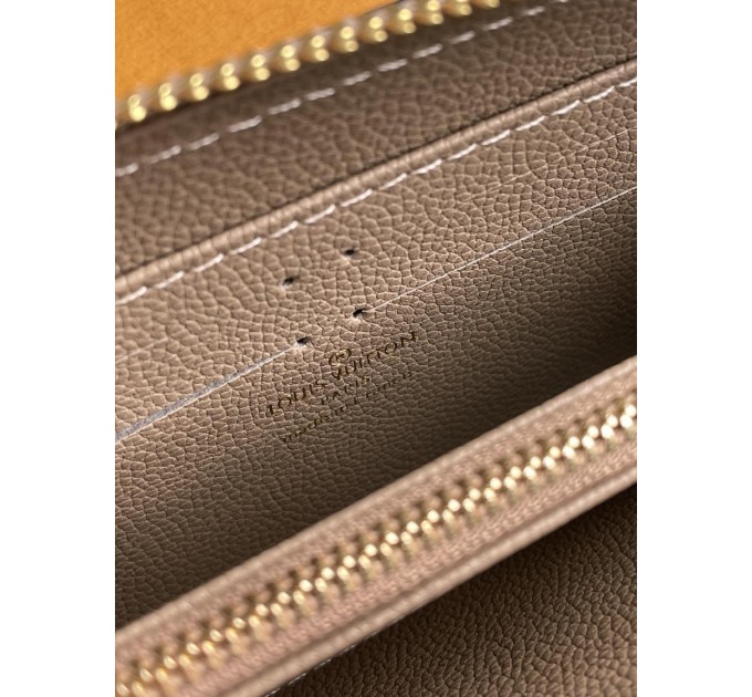 Клатч Louis Vuitton Clemence: двоколірний бежевий із фірмовим тисненням