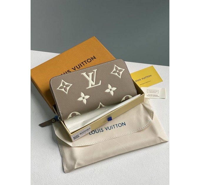 Клатч Louis Vuitton Clemence: двоколірний бежевий із фірмовим тисненням