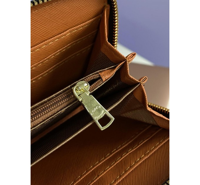 Клатч Coach Dempsey: фірмовий Jacquard та екошкіра