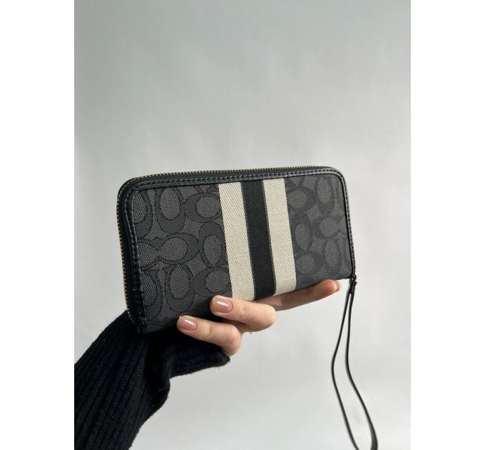 Клатч Coach Dempsey: фірмовий Jacquard та екошкіра