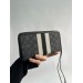Клатч Coach Dempsey: фірмовий Jacquard та екошкіра