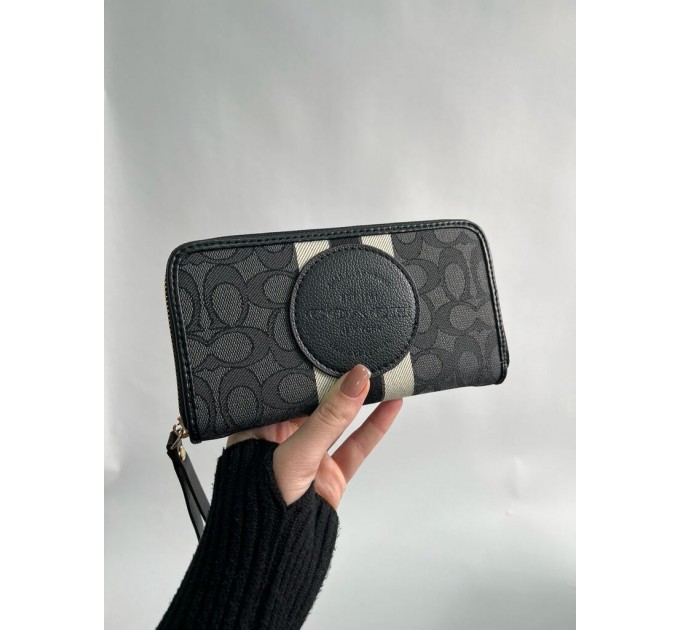 Клатч Coach Dempsey: фірмовий Jacquard та екошкіра
