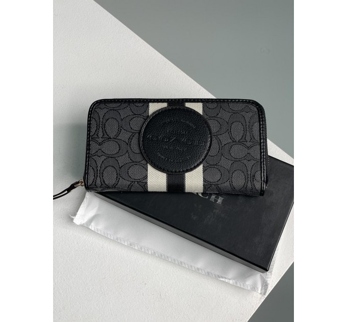 Клатч Coach Dempsey: фірмовий Jacquard та екошкіра