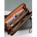 Клатч Coach Dempsey: фірмовий Jacquard та екошкіра