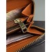 Клатч Coach Dempsey: фірмовий Jacquard та екошкіра