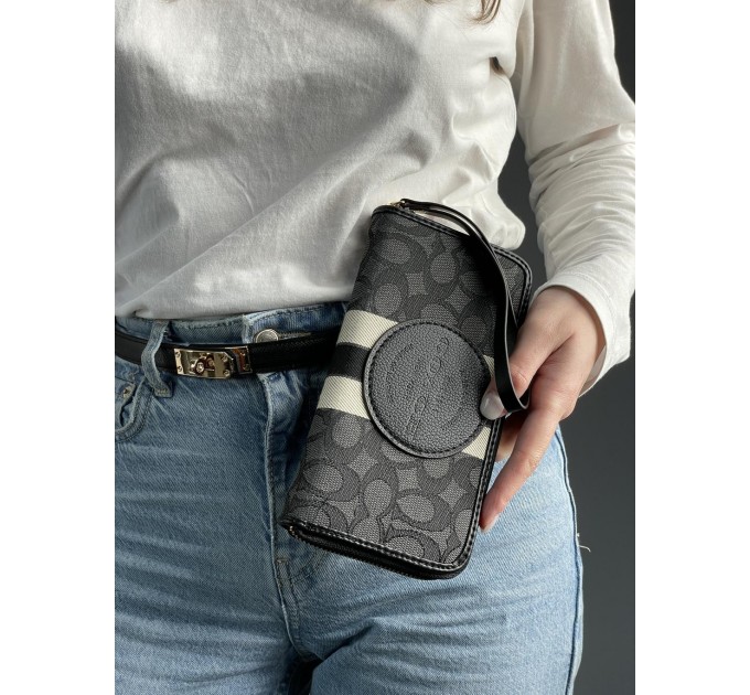 Клатч Coach Dempsey: фірмовий Jacquard та екошкіра