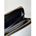 Клатч Prada Round Zippy: текстурна шкіра Nero Black