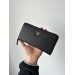 Клатч Prada Round Zippy: текстурна шкіра Nero Black